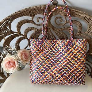 Handmade, multicolor Wolven towed from Pueblo Mexico medium